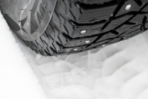 car tire snow close up car tracks snow traces car snow winter tires tyres covered with snow winter road winter road safety concept