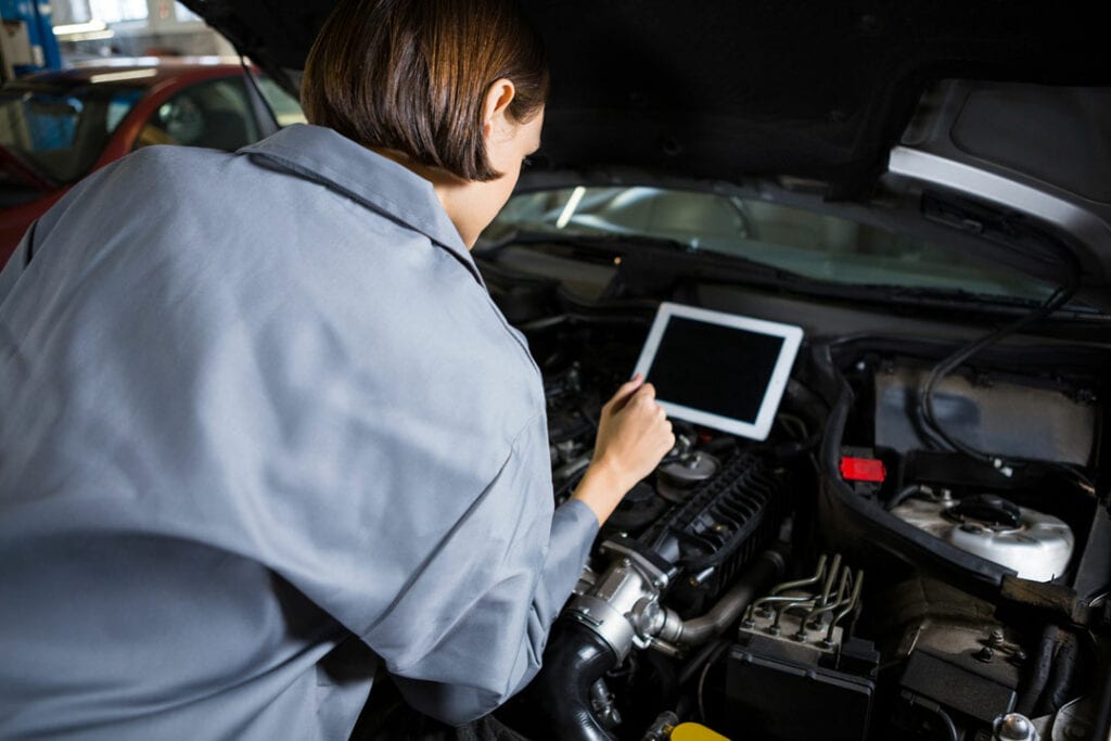 Is Hybrid Car Maintenance Expensive? - Female Mechanic Using Diagnostic Tool 1024x683